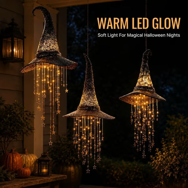 Warm glowing witch hat hanging lights in an outdoor Halloween setting